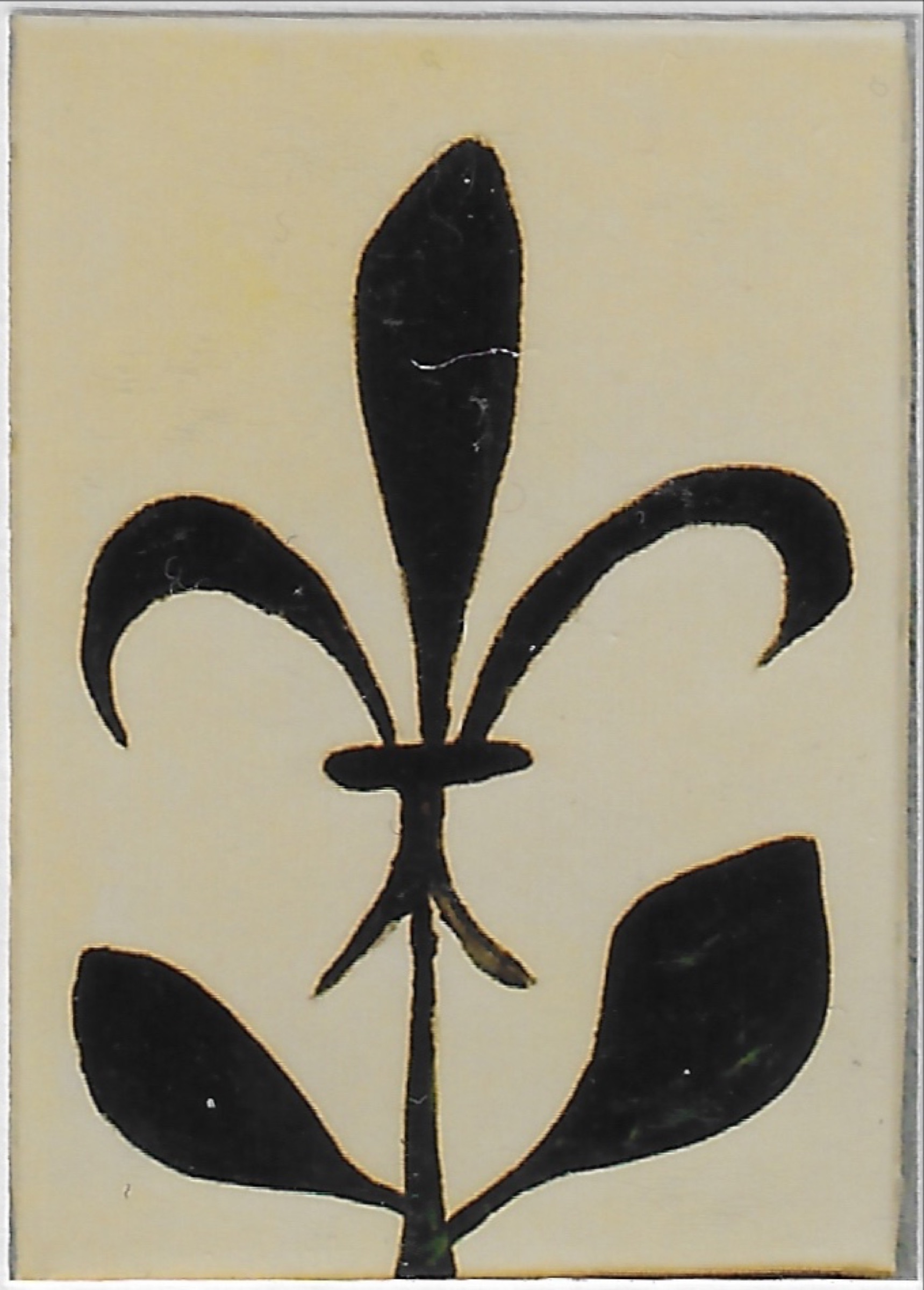 Fleur de lys noir sur tige avec deux feuilles, fond clair